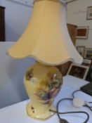 An Aynsley table lamp with golden yellow coloured shade