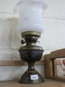 A brass based oil lamp