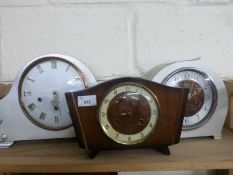 Two silver painted mantel clocks and one other