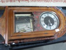 A reproduction mahogany styled wall clock with adaptations, approx 93cm high