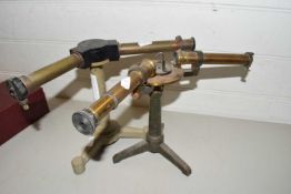 Two vintage spectroscopes mounted on tripod bases
