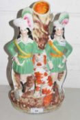 Victorian Staffordshire flat back spill vase decorated with two figures and a spaniel