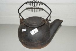 Cast iron teapot with looped handle
