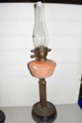 Victorian oil lamp with peach glass font and brass column base
