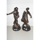 A pair of late 19th Century Spelter figures set on turned bases