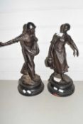 A pair of late 19th Century Spelter figures set on turned bases
