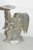 A cast metal angel formed candlestick