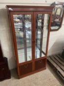 Modern two door glazed and mirror back display cabinet