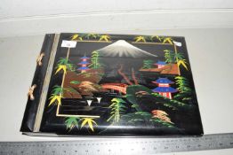 An early 20th Century Japanese lacquered photograph album with integral musical movement