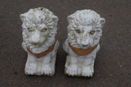 Pair of small cast concrete lions, 37cm high