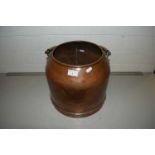 A heavy gauge copper small churn or bucket of circular form with looped swing handle