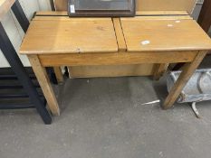 A twin school desk with hinged lids