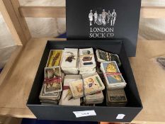A box of assorted cigarette cards