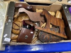 Box of assorted wood carved items and a pair of binoculars