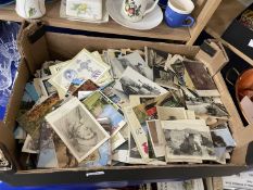 A box of assorted photographs