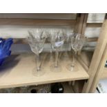 A group of six wine glasses with engraved floral decoration