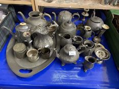 A quantity of mixed pewter and other metal wares to include teapots, tea wares, a tray, candlesticks