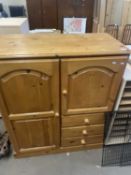 Pine tallboy with cupboards and three drawers