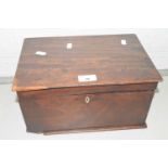 A small mahogany box containing a range of various early 20th Century postcards