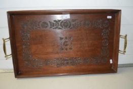 A mahogany serving tray with carved decoration