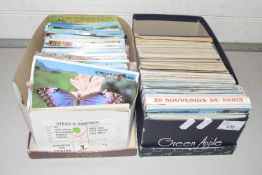 Two boxes of assorted postcards