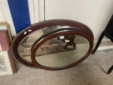 Two oval mahogany framed wall mirrors