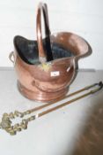 Copper coal helmet and a pair of brass fire tongs