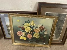 A reproduction print of a vase of roses together with a picture of country houses and sheep on a