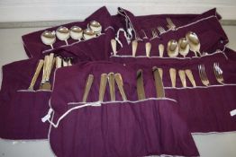 Collection of silver plated cutlery in fabric wraps