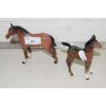 A Royal Doulton foal together with a further Beswick foal