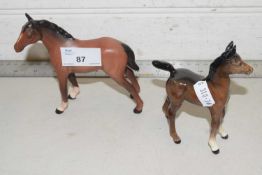 A Royal Doulton foal together with a further Beswick foal
