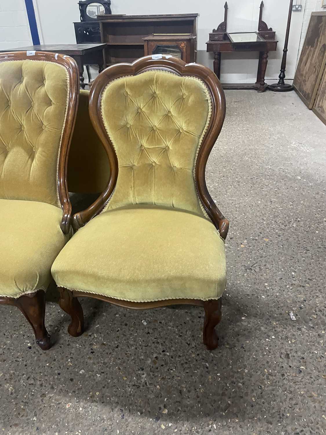 A Victorian yellow upholstered button back nursing chair on short cabriole legs, 89cm high
