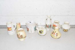 A collection of various small crested vases