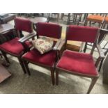 Set of three red upholstered chairs