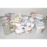 A collection of various assorted small ceramics and glass jugs