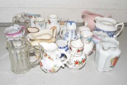 A collection of various assorted small ceramics and glass jugs
