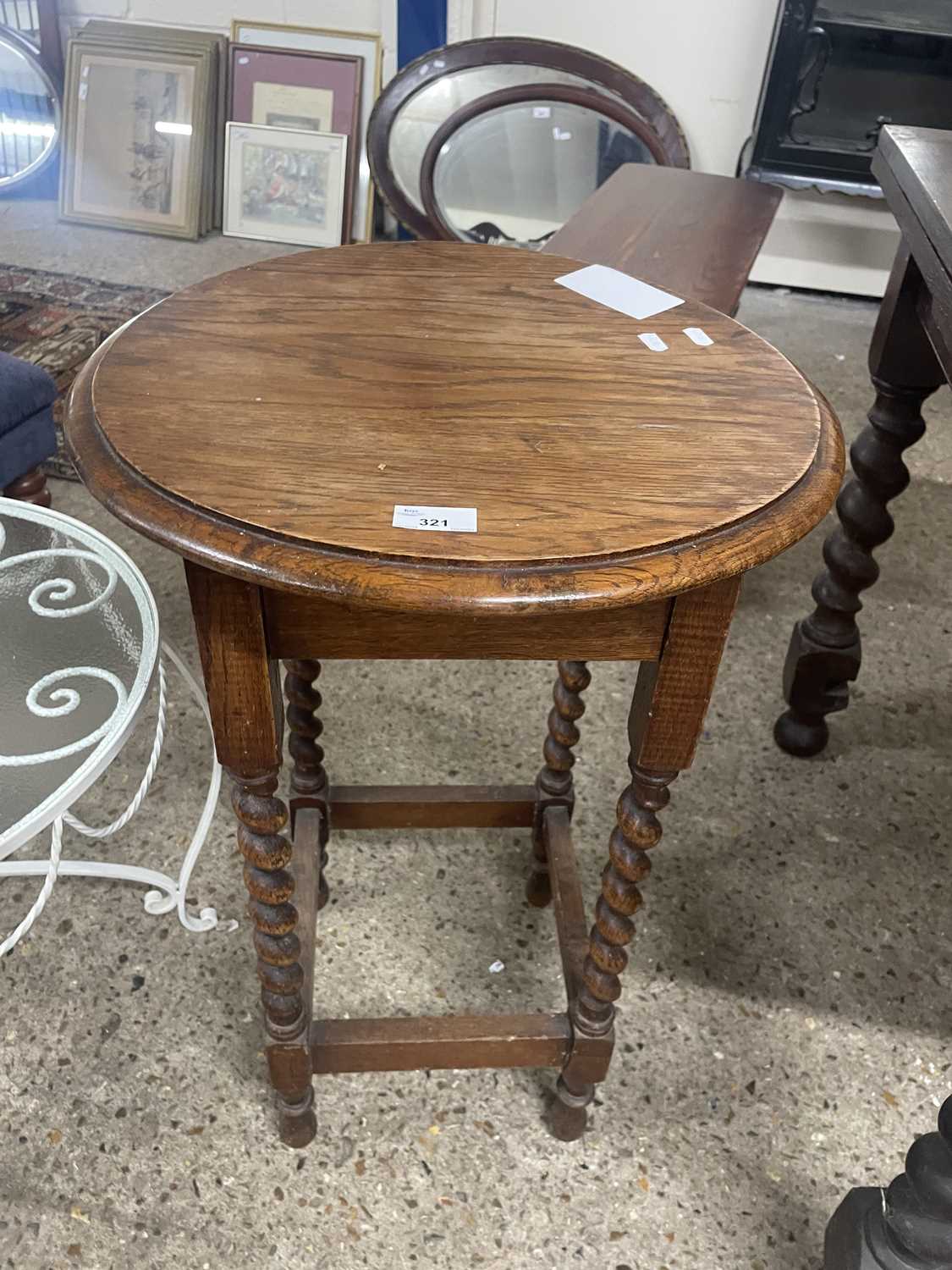 An early 20th Century oak occasional table on barley twist legs