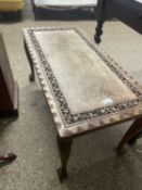 Far Eastern hardwood coffee table with carved decoration