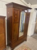 Edwardian mahogany wardrobe with central mirrored door and drawer base