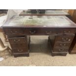 A reproduction leather top twin pedestal desk, 120cm wide