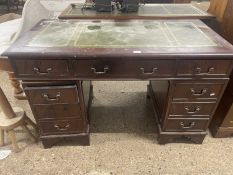 A reproduction leather top twin pedestal desk, 120cm wide