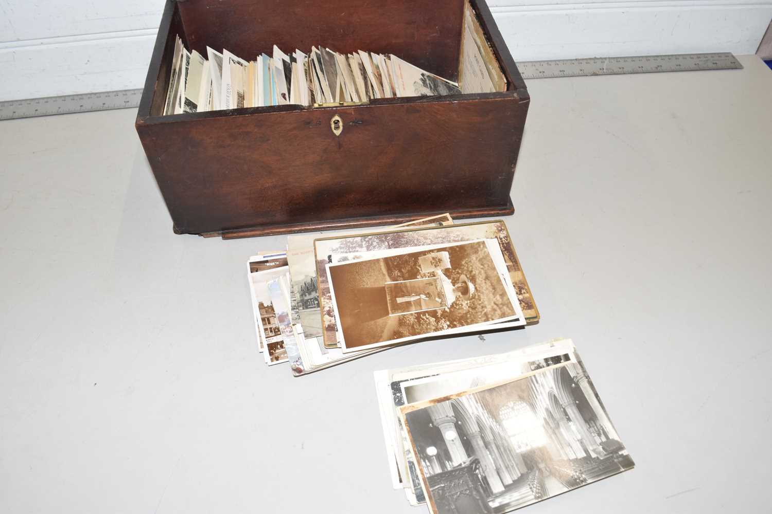 A small mahogany box containing a range of various early 20th Century postcards - Image 2 of 2