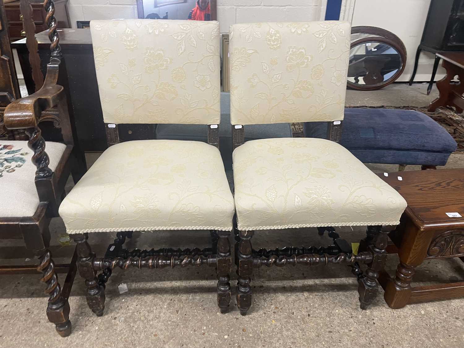 Pair of cream upholstered dining chairs with barley twist frames