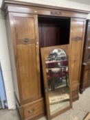 Edwardian mahogany wardrobe with central mirrored door and draw base, 152cm wide