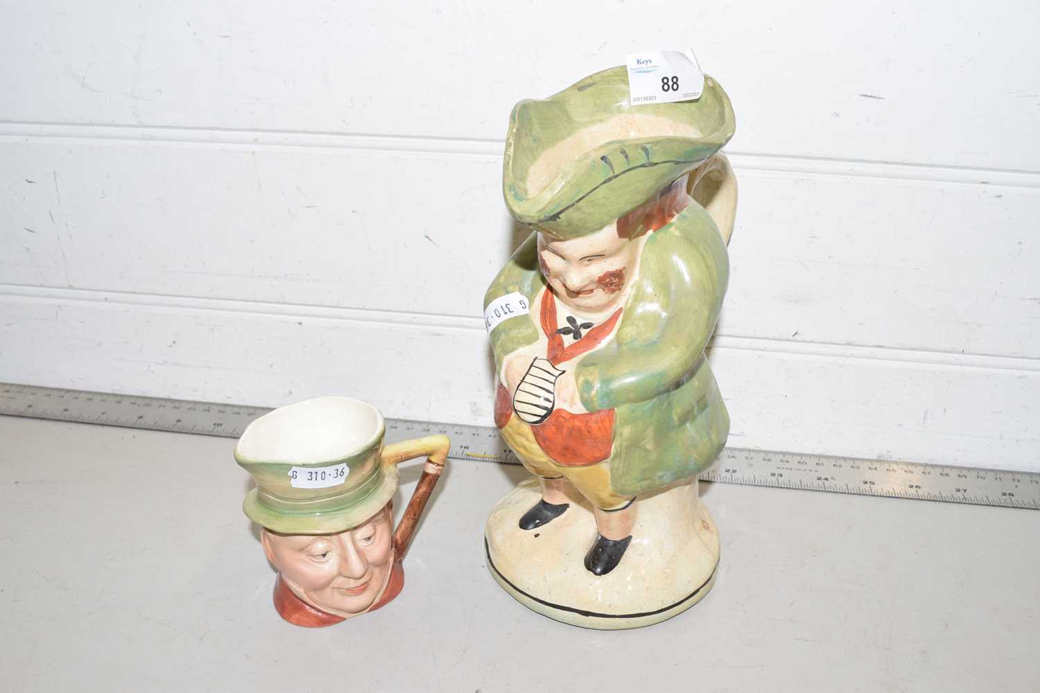 A 19th Century Toby jug together with a further small Beswick Micawber character jug