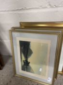 A pair of framed prints of landscapes together with a reproduction French street scene, framed and