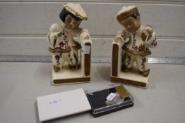 A pair of Oriental style ceramic book ends together with a section of wooly mammoth tusk (3)