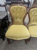 A Victorian yellow upholstered button back nursing chair on short cabriole legs, 90cm high