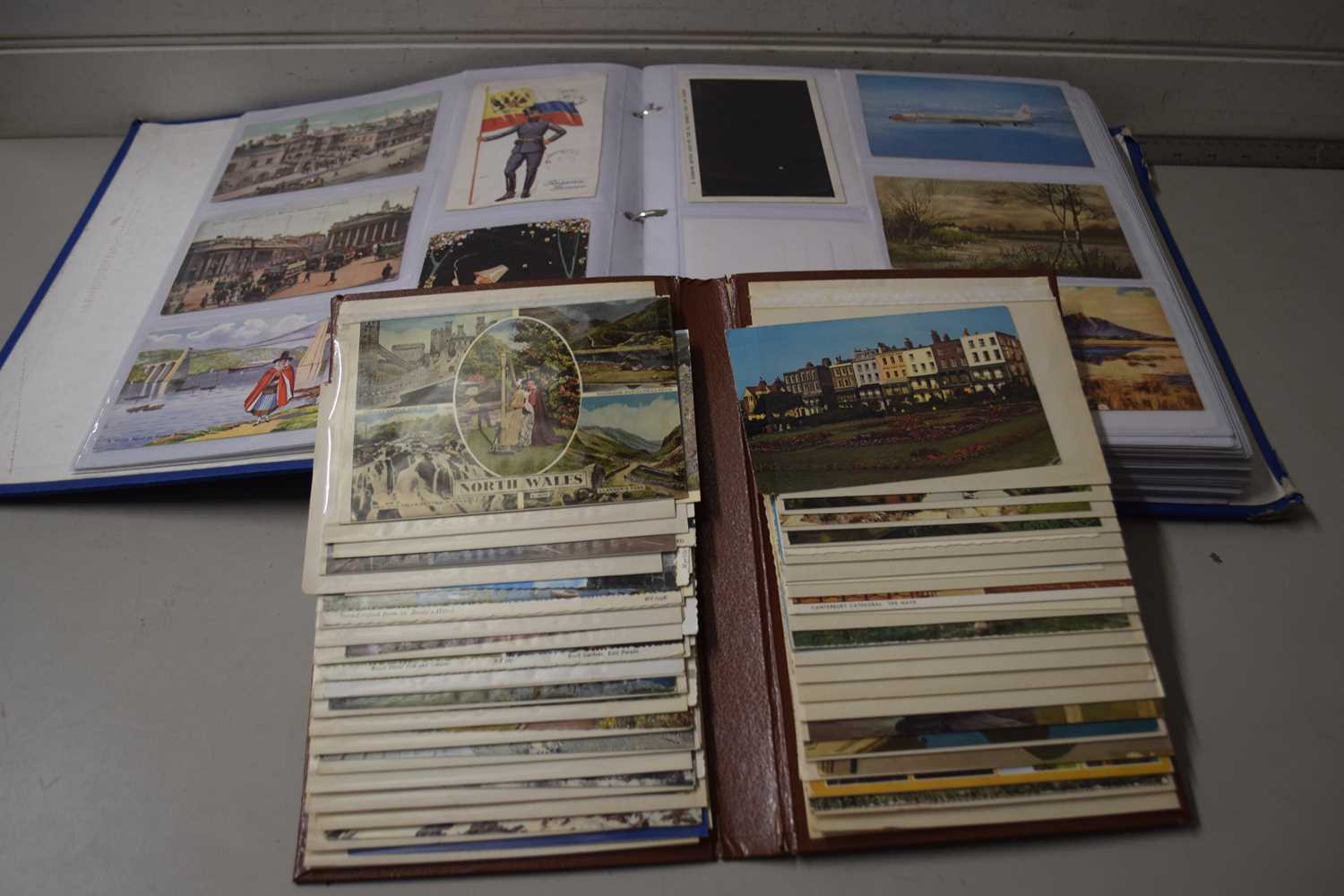 Two albums of assorted postcards