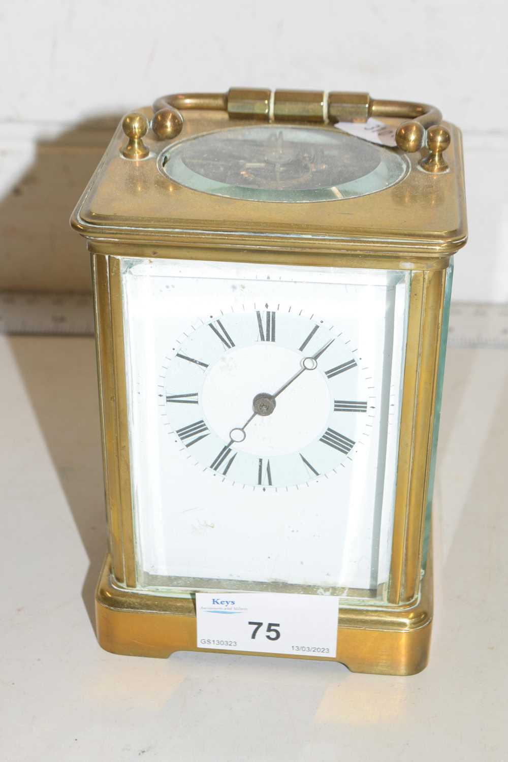 A French brass cased carriage clock with coloured enamelled dial